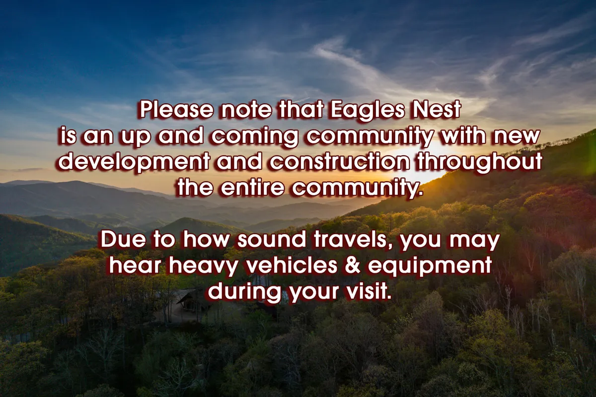 A panoramic view over the mountains at sunset, with hints of community activity in the valley. The vivid sky and vast landscape convey the natural splendor and sense of adventure that define the area across all seasons.